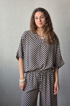 Blusón oversize estampado de flores negro