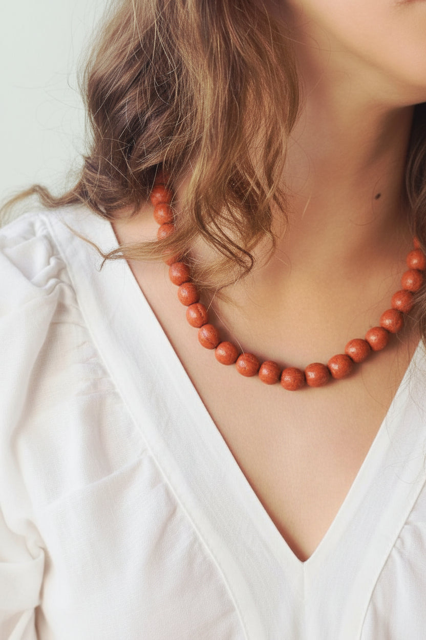 Collar de bolas mostaza