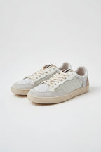 Sneakers blancas con detalles glider dorado