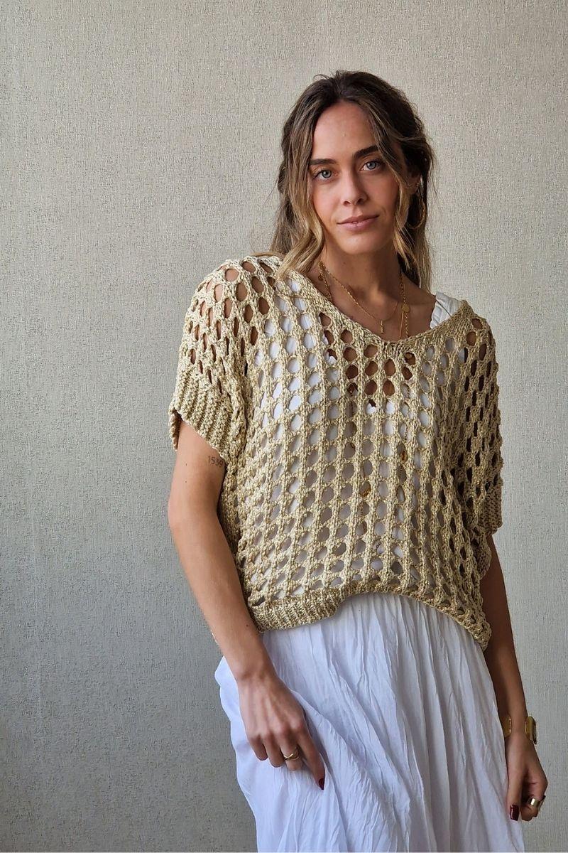 Jersey de punto calado dorado sin mangas