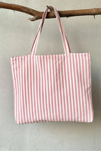 Bolso mediano con cremallera de rayas rosa