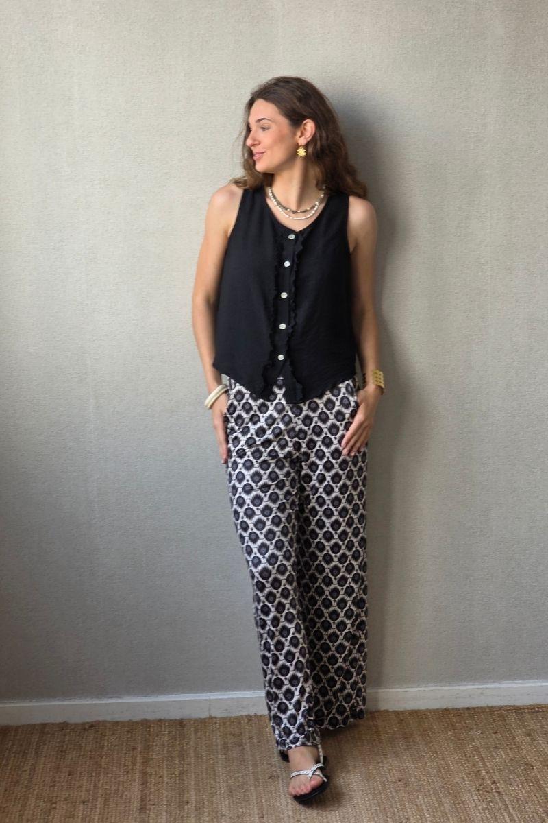 Pantalón estampado fuego con bolsillos negro