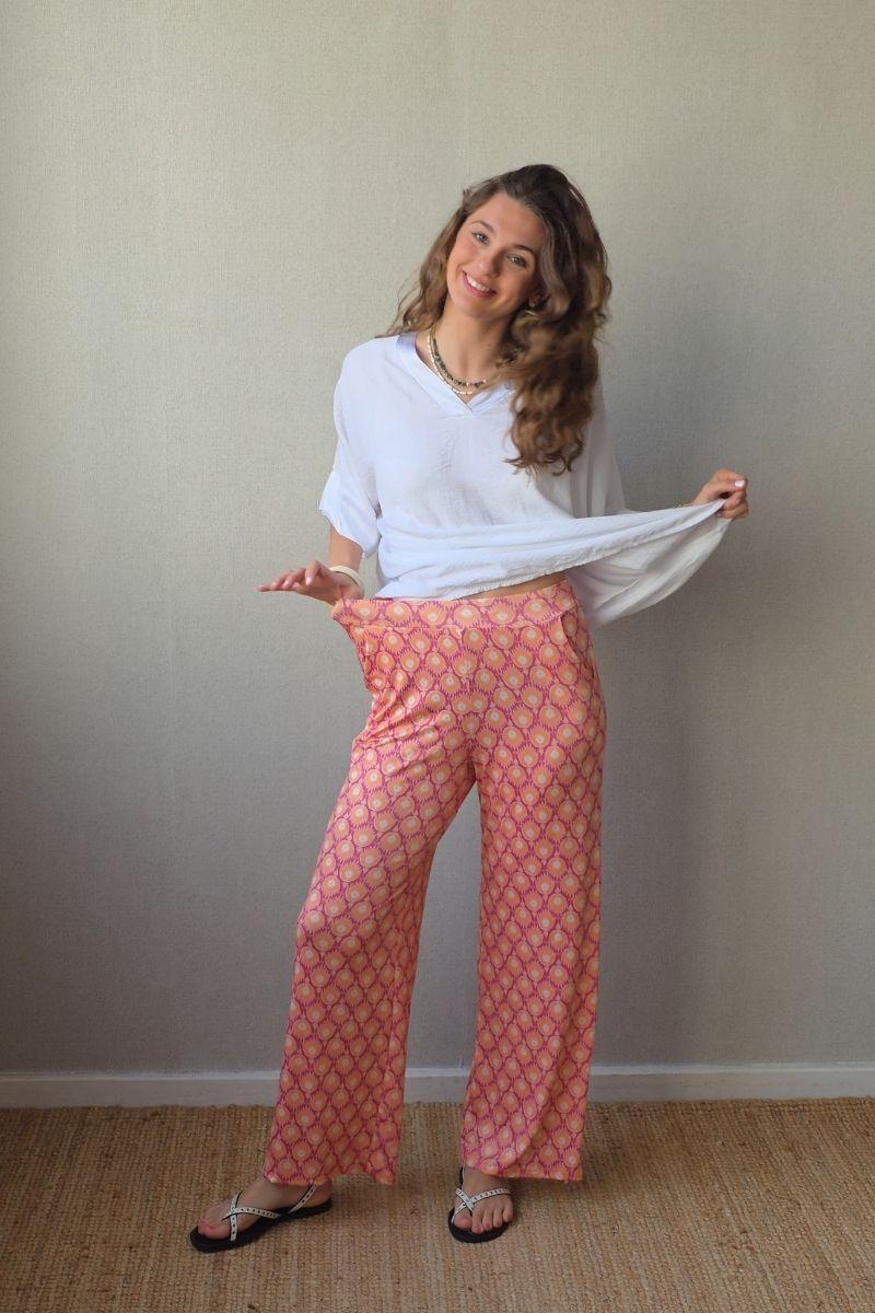 Pantalón estampado fuego bolsillos naranja