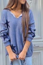 Jersey punto cuello pico con estrellas azul