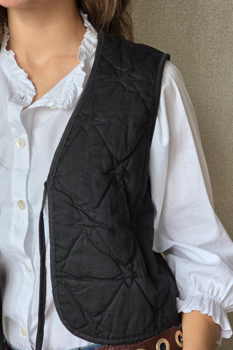 Chaleco acolchado con estrellas negro