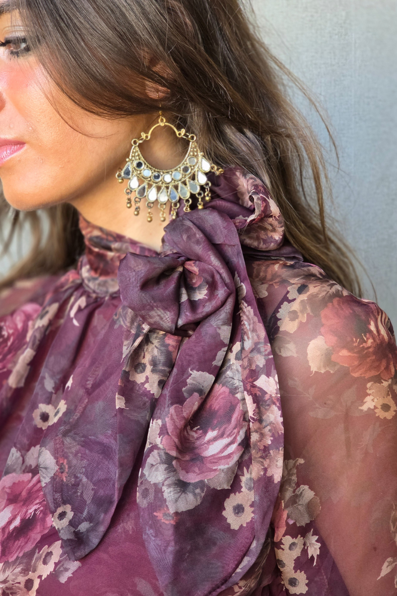 Blusa Bloom estampado de flores y lazo granate