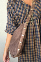Boslo topo oversize con detalles dorados