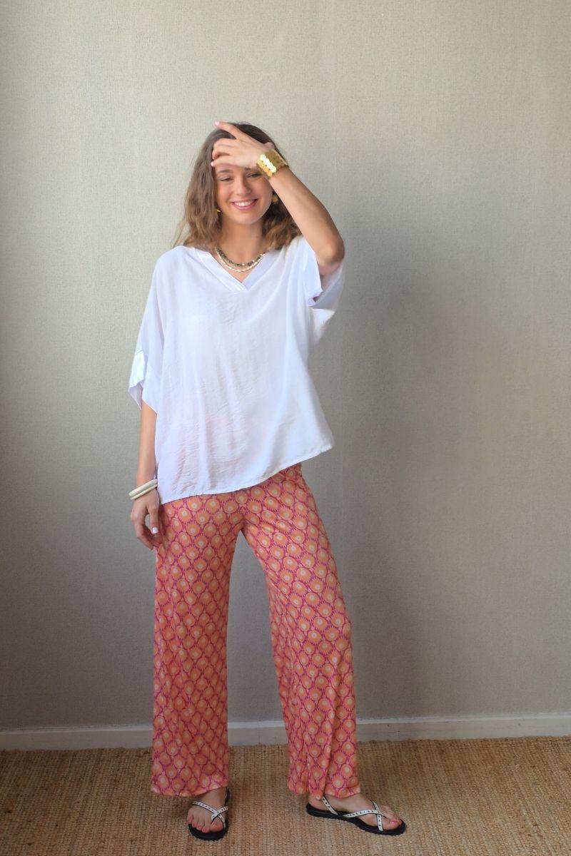 Pantalón estampado fuego bolsillos naranja