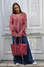 Jersey punto cuello pico con estrellas rosa pepe