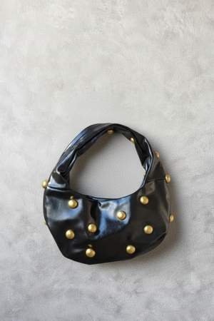 Bolso baguette negro con tachas