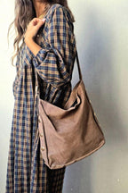 Boslo topo oversize con detalles dorados