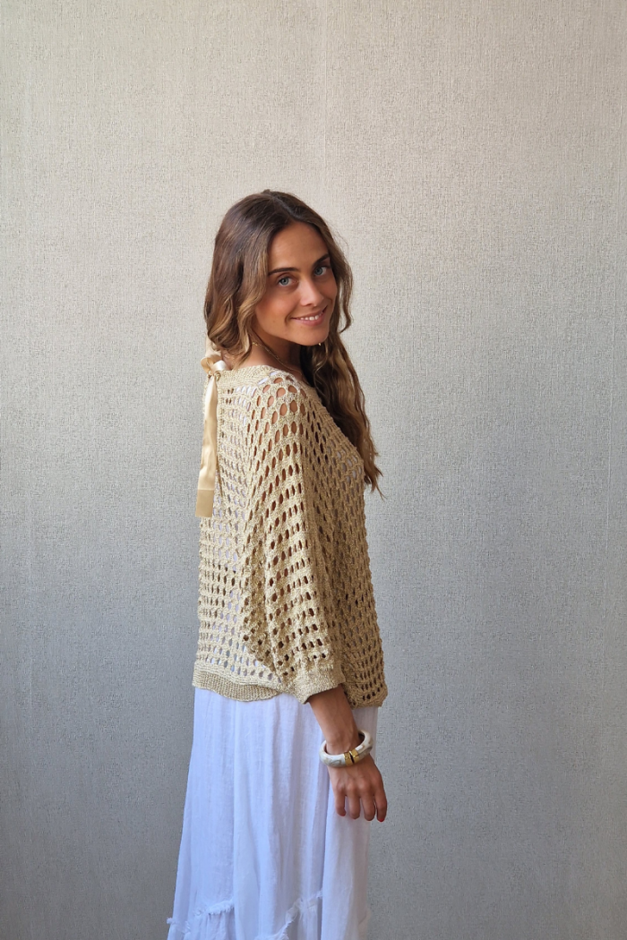 Jersey de punto calado con lazo dorado