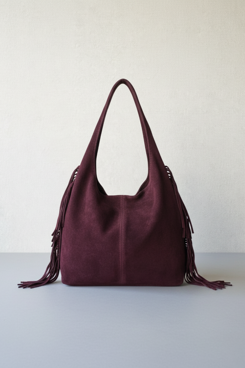 Bolso de piel con flecos granate