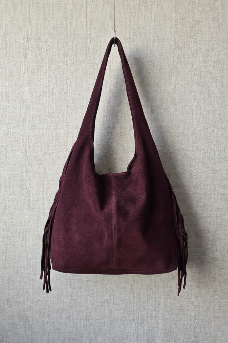 Bolso de piel con flecos granate