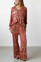 Pantalón de punto color caldero con lentejuelas