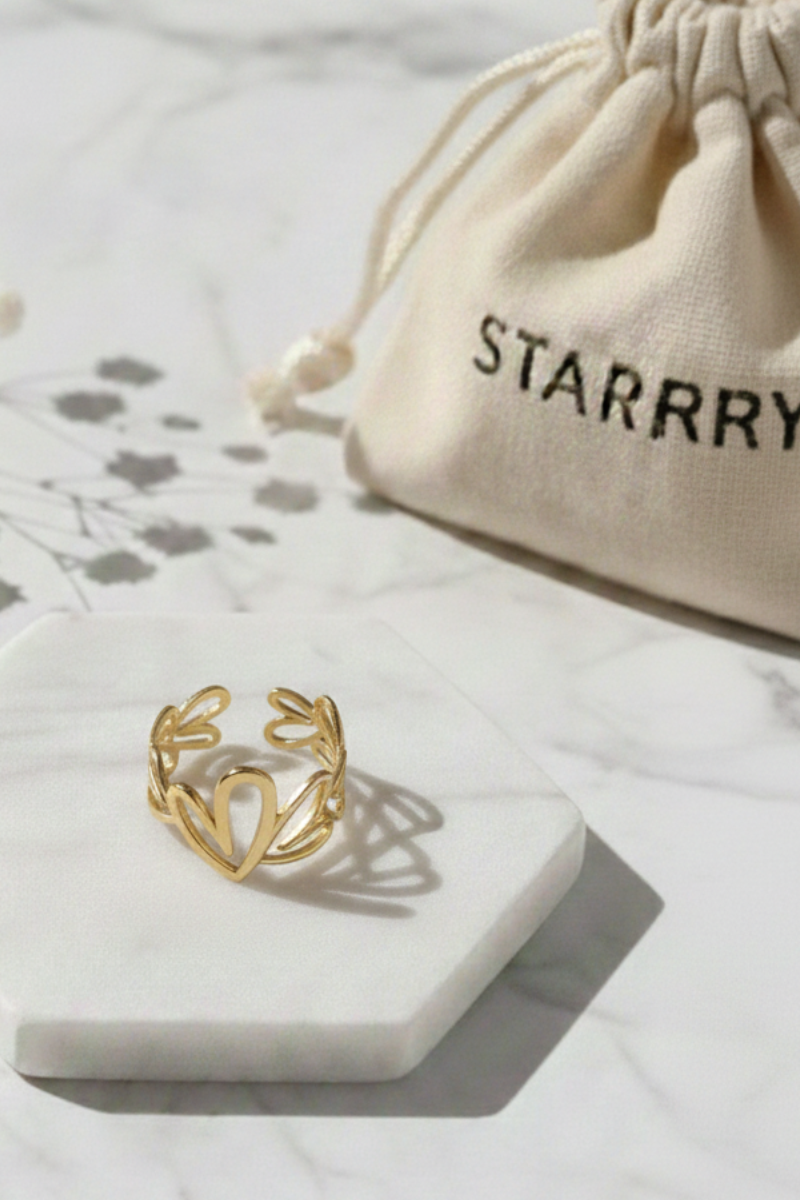 Anillo corazones de acero dorado