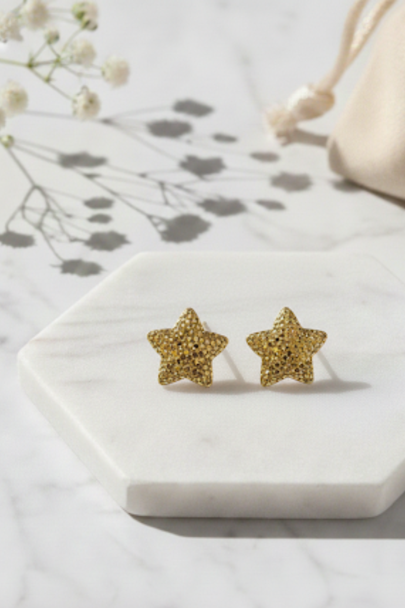 Pendientes pegado acero estrella doradas