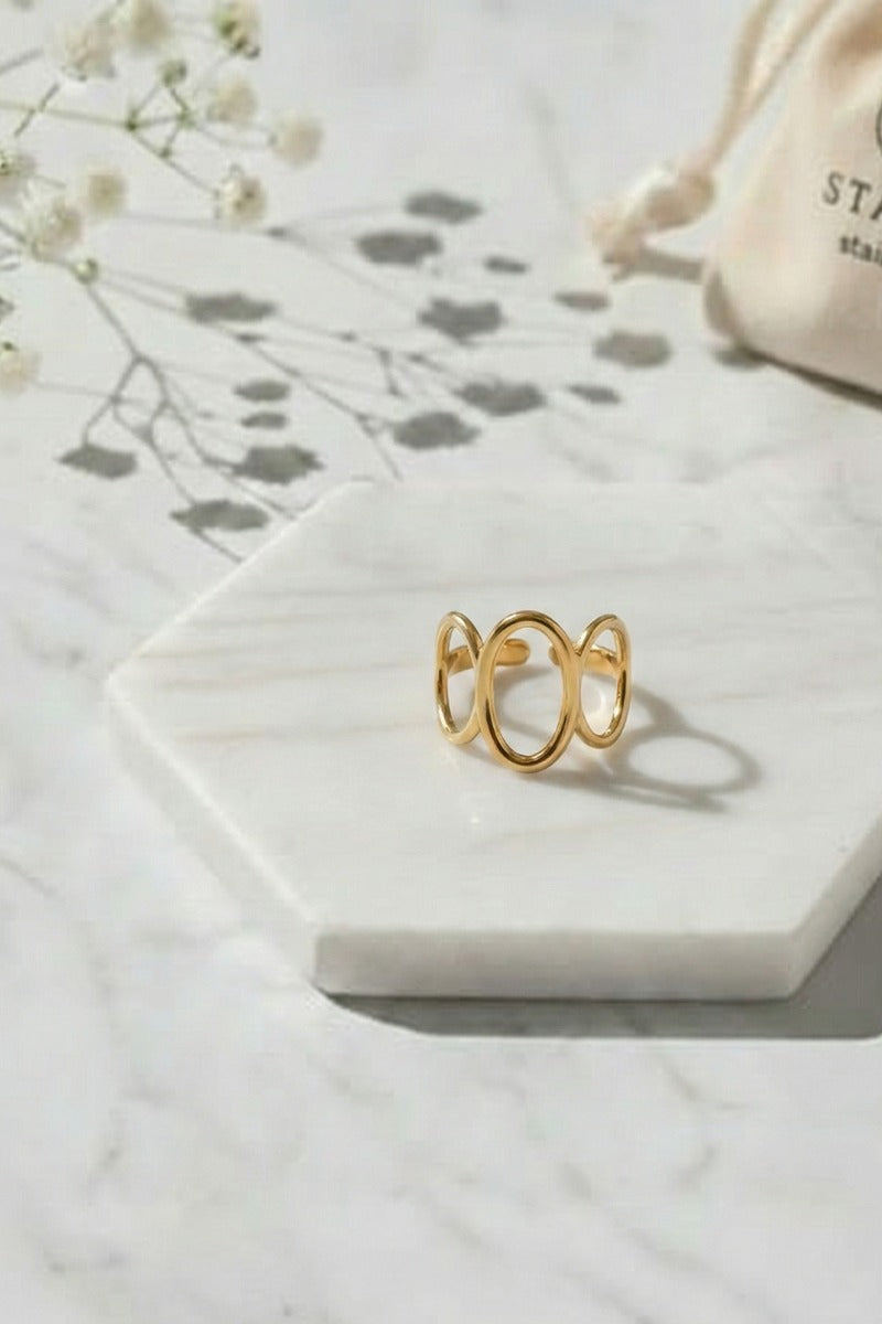 Anillo Ajustable tres óvalos acero dorado